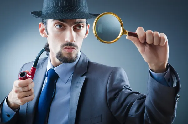 Detective with the smoking pipe — Stock Photo, Image