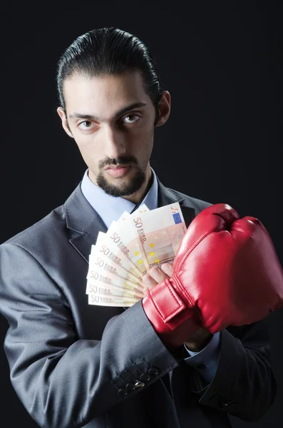 Człowiek z Rękawice bokserskie i pieniądze — Zdjęcie stockowe