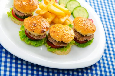 Plate with tasty mini burgers clipart