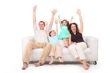 Parents and children with rised hands on white leather sofa clipart