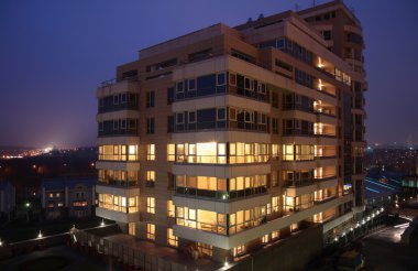 Office building at evening clipart