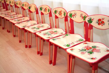 Children's chairs in kindergarten clipart