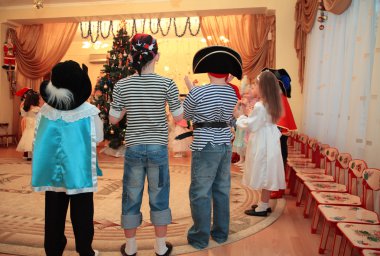Children on New Year's holiday in kindergarten clipart