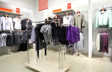 Interior of shop of clothes clipart