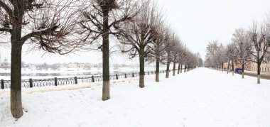 Snowbound avenue on embankment clipart