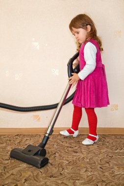 Little Girl vacuum a carpet clipart