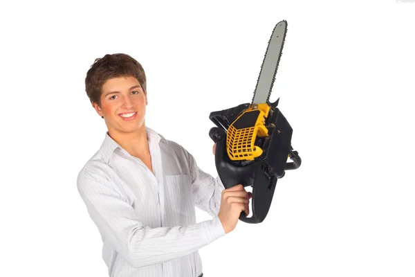 Young man shows chainsaw — Stock Photo, Image
