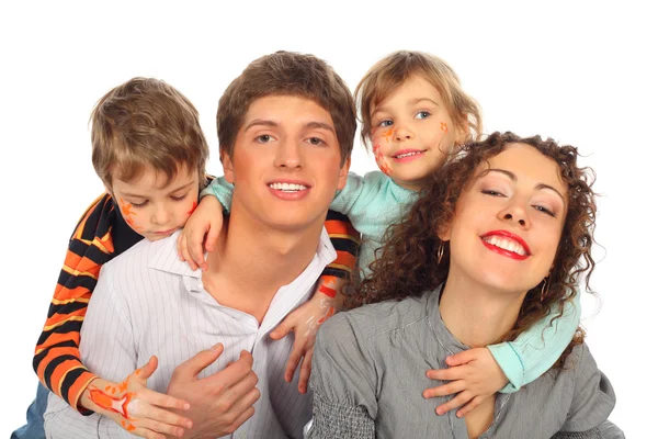 Família de quatro com desenhos no rosto das crianças — Fotografia de Stock