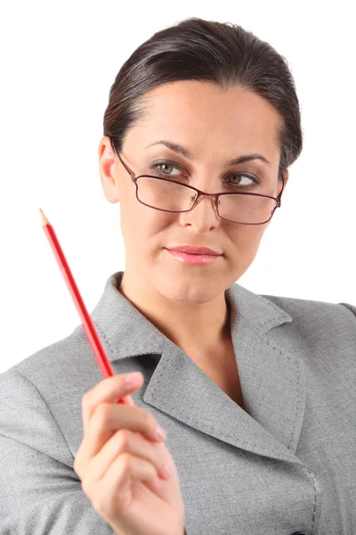 Business woman holding pancil — Stock Photo, Image