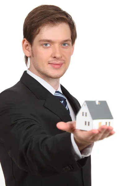 Young man holding home — Stock Photo, Image