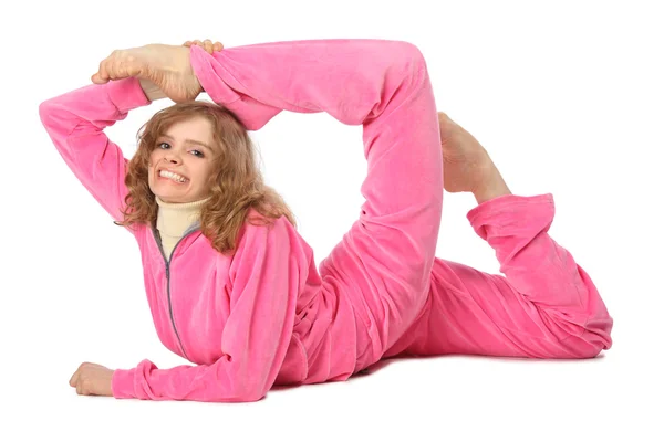 Girl in pink clothes does gymnastic exercise — Stock Photo, Image