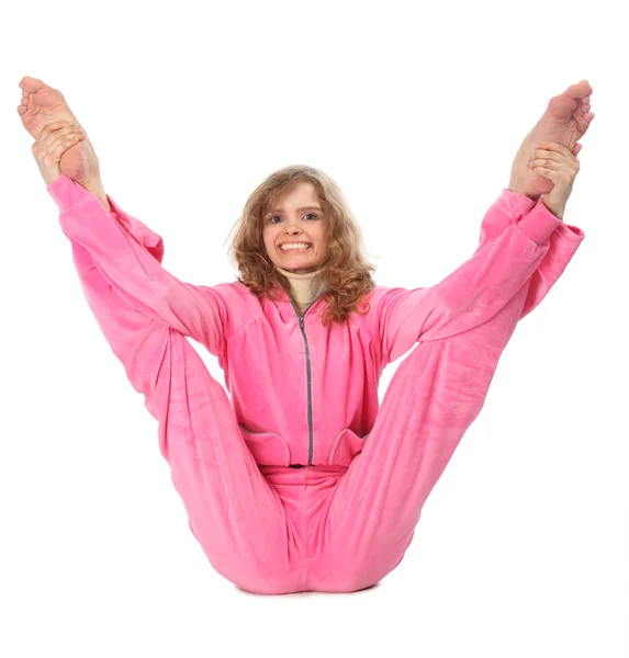 Meisje in roze kleren doet gymnastische oefening — Stockfoto