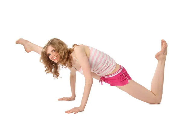 Girl in sportswear makes gymnastic — Stock Photo, Image