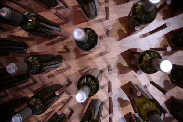 Wine bottles on wall — Stock Photo, Image