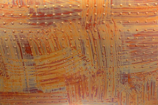 リベットでオレンジ色の表面 — ストック写真