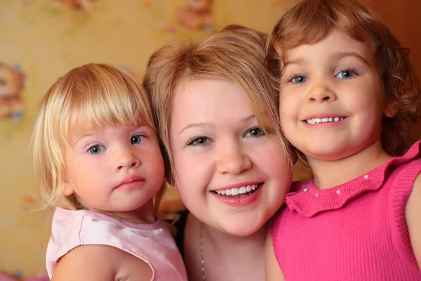 Girl with two children — Stock Photo, Image