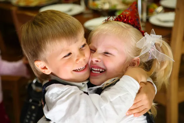 Children embrace on holiday in kindergarten — Stock Photo, Image