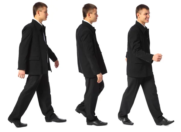 Young smiling businessman walks — Stock Photo, Image