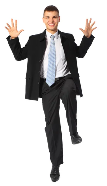 Young smiling businessman jumps — Stock Photo, Image