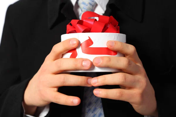 Businessman with gift box in hands — Stock Photo, Image