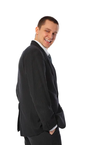 Młody biznesmen uśmiechający się pół kolei — Zdjęcie stockowe