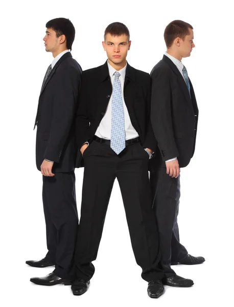 Three young businessmen stand semicircle — Stock Photo, Image