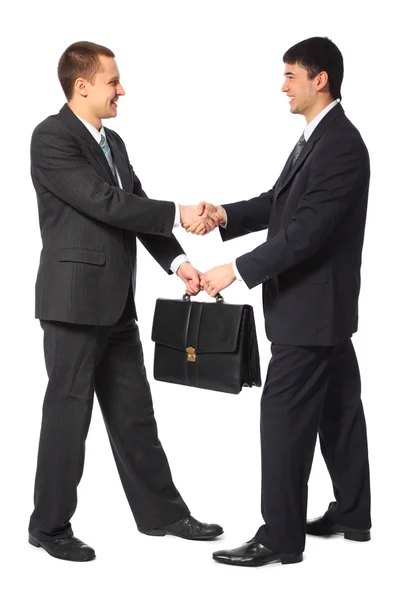 One businessman gives another briefcase full body — Stock Photo, Image