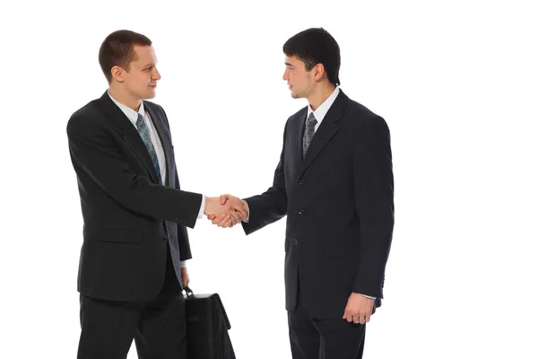Two young businessmen greet — Stock Photo, Image
