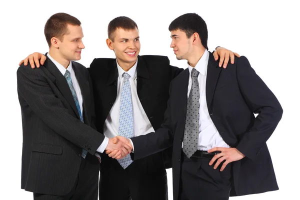 Empresário observa aperto de mão de dois outros — Fotografia de Stock