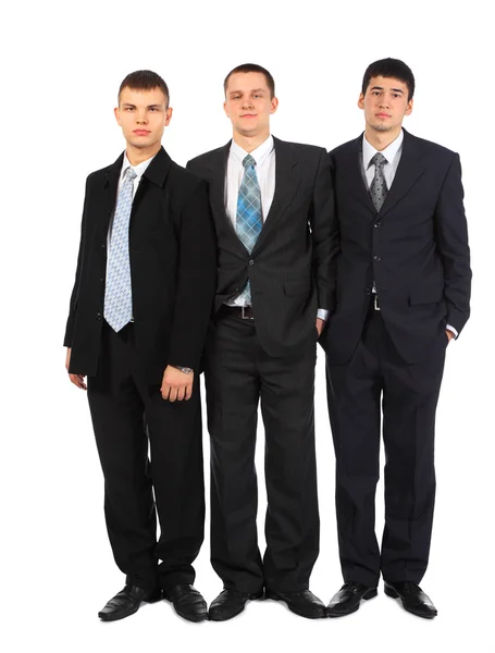 Tre stående unga affärsmän — Stockfoto
