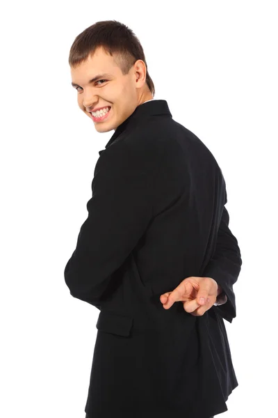 Hombre de negocios sonriente con los dedos cruzados detrás de su espalda — Foto de Stock