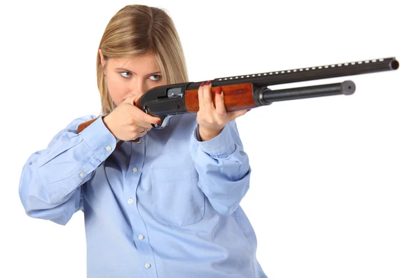 Young woman with shotgun — Stockfoto