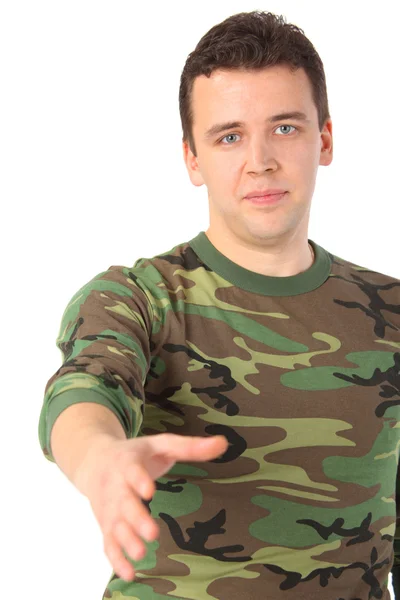 Man in camouflage begroet — Stockfoto