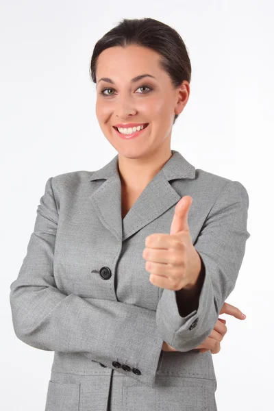 Young business woman showing success sign — Stock Photo, Image