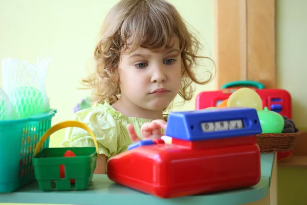 Little girl plays shop — Stock Photo, Image