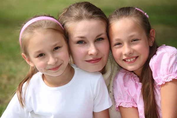 Mother with daughters outdoor in summer — Stock Photo, Image