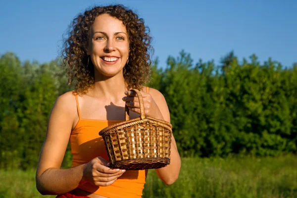 Young Women with basket on glade — Stock Photo, Image