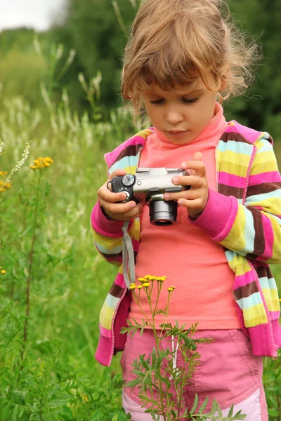 Little girl with photo camera outdoor — Stock Photo, Image