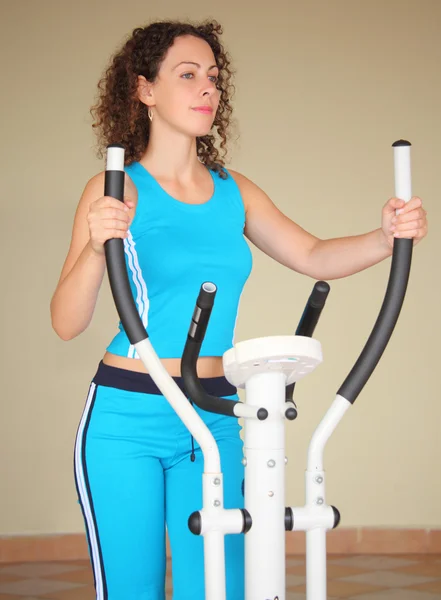 Girl on training apparatus — Stock Photo, Image
