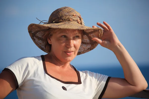 Portrait of middleaged woman in hat outdoor — Stock Photo, Image