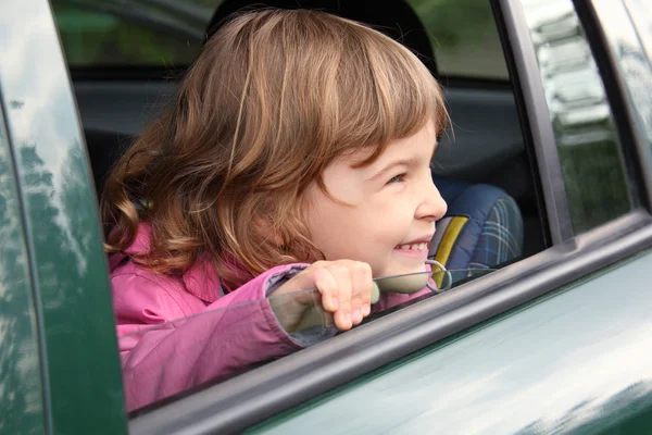 Girl in the car — Stock Photo, Image