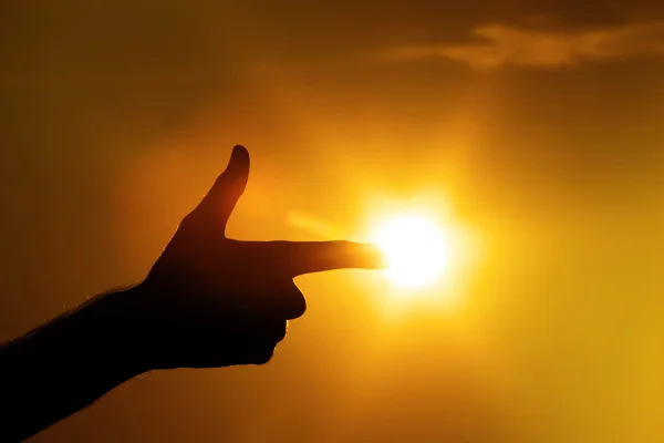 Dedo apontando para o gesto do sol — Fotografia de Stock