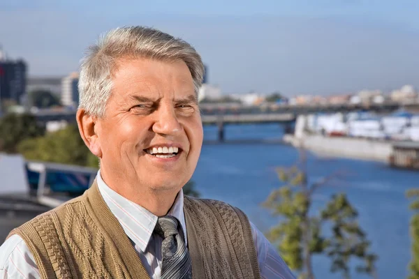 Senior man by the river — Stock Photo, Image