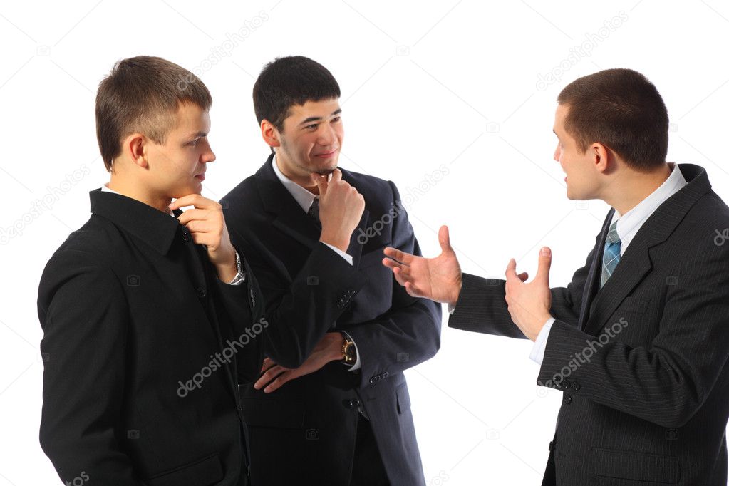Three young businessmen talk