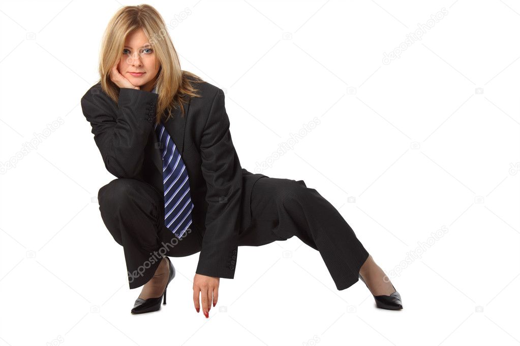Young pretty businesswoman squats
