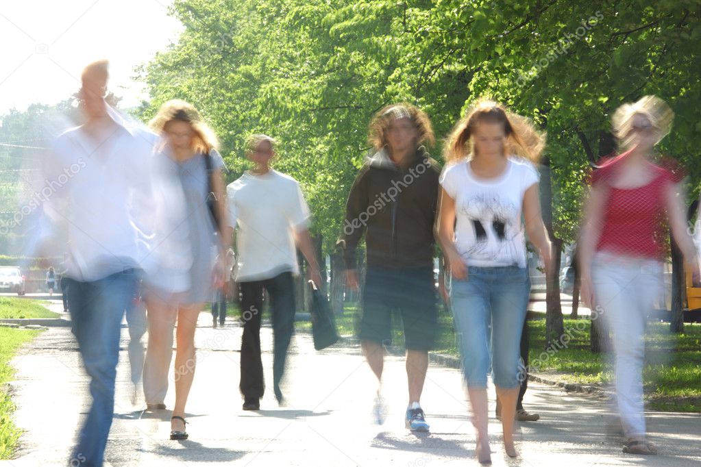 Passers-by in street in summer