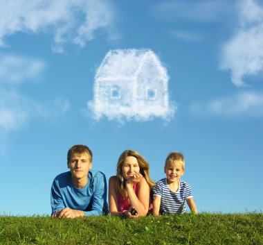 Family with boy on grass and dream cloud house collage clipart