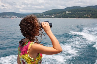 Observing in binocular sea coast clipart