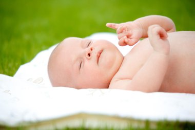 The baby sleeps in the open air clipart