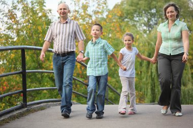 Family in early fall park clipart